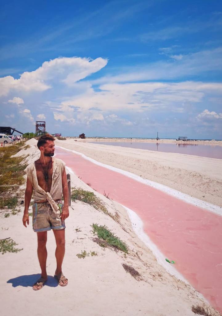 ATV Excursion Las Coloradas Yucatan Salt Flats Pink Water with Pink Flamencos, with EMf RMF Protection armor shorts with neon reflective accents. Holistic Retreats Rivera Maya.
