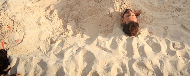 earthing buried in sand tulum